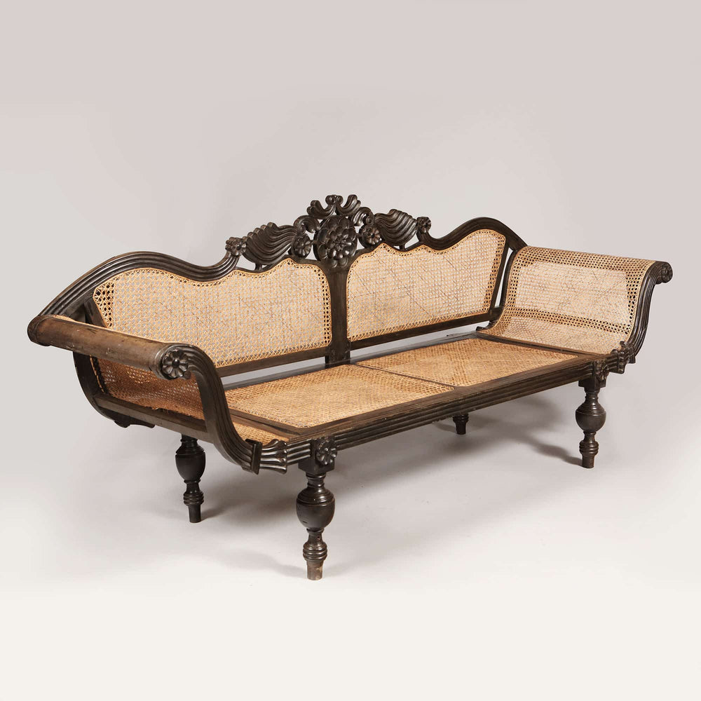 British colonial carved solid ebony sofa with caned seat and back by Collection EE20 circa 1850