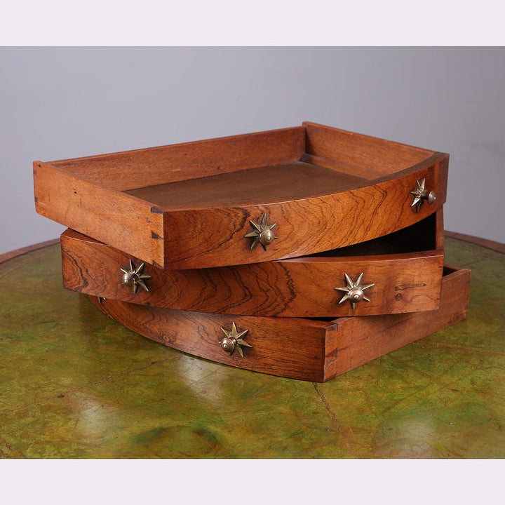 Regency Rosewood Drum Table showing three scalloped drawers with brass star handles and lion mask detailing.