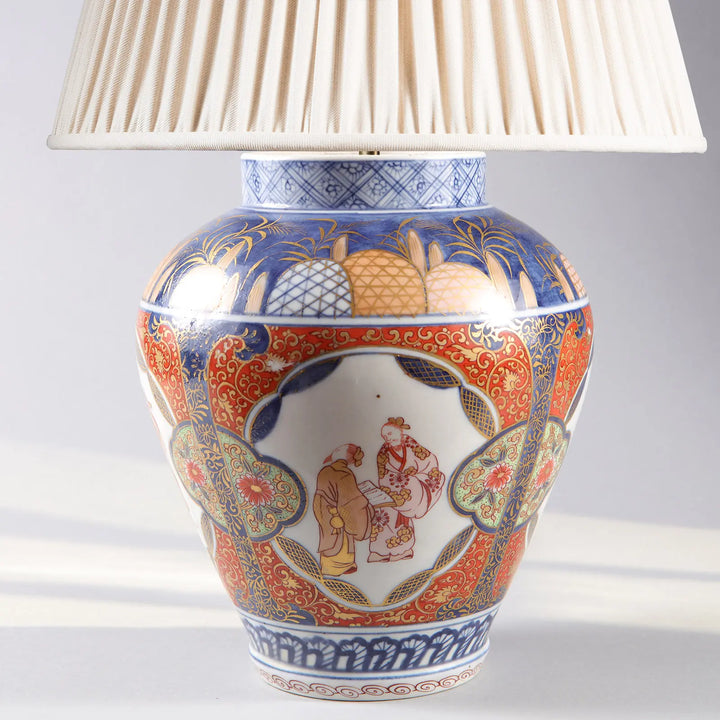 Near Pair of Japanese Imari Vases as Lamps with intricate red and blue porcelain designs from Japan, Circa 1890.