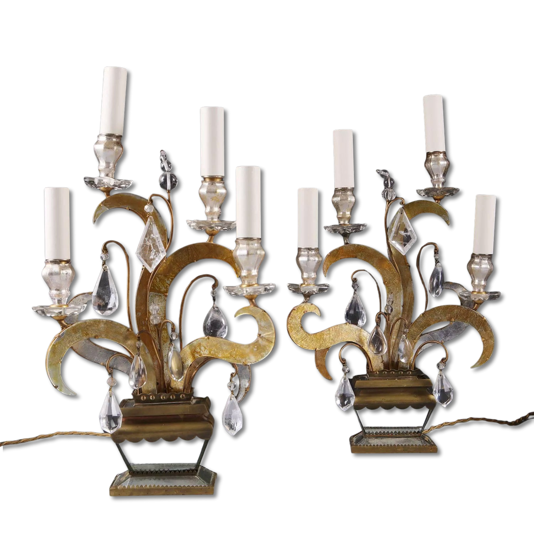 Pair of Maison Bagues Four Light Flame Candelabra with gilt flames, eglomise glass, crystal drops on mirrored vase bases.