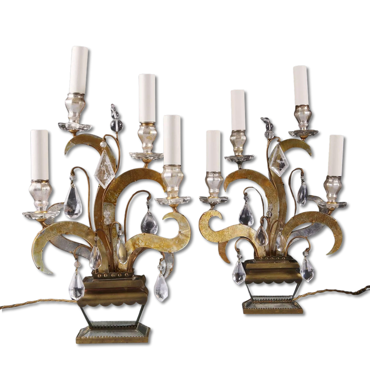 Pair of Maison Bagues Four Light Flame Candelabra with gilt flames, eglomise glass, crystal drops on mirrored vase bases.