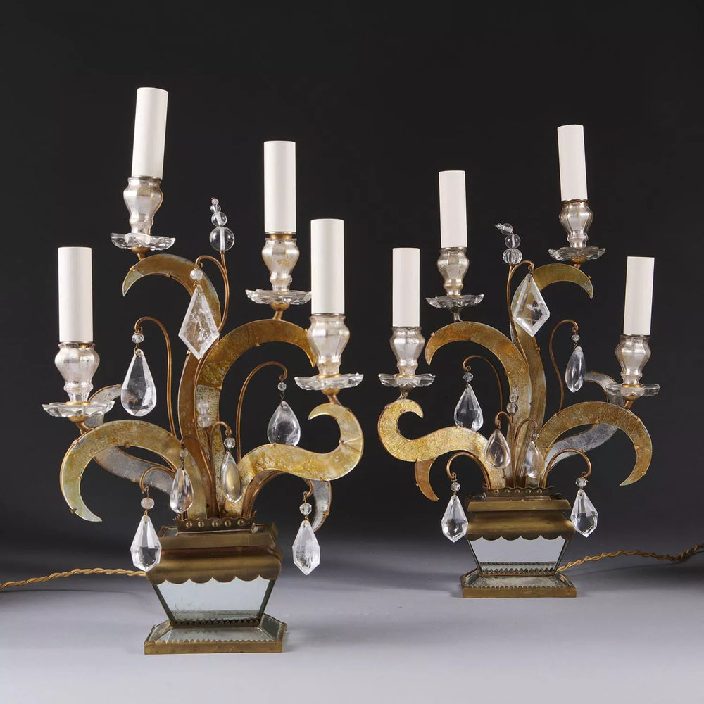 Pair of Maison Bagues Four Light Flame Candelabra with gilt flames, eglomise glass, rock crystal drops, and mirrored bases.