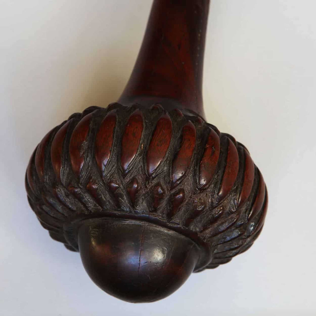 Close-up of the carved handle design on a Fijian I Ula Tavatava Throwing Club wooden weapon