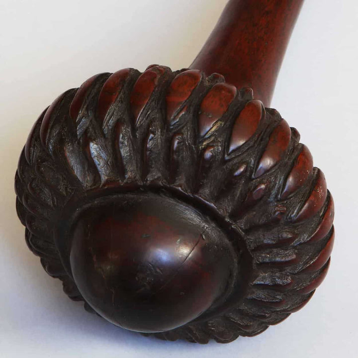 Fijian I Ula Tavatava Throwing Club carved wooden tribal weapon with intricate detailing on rounded head.