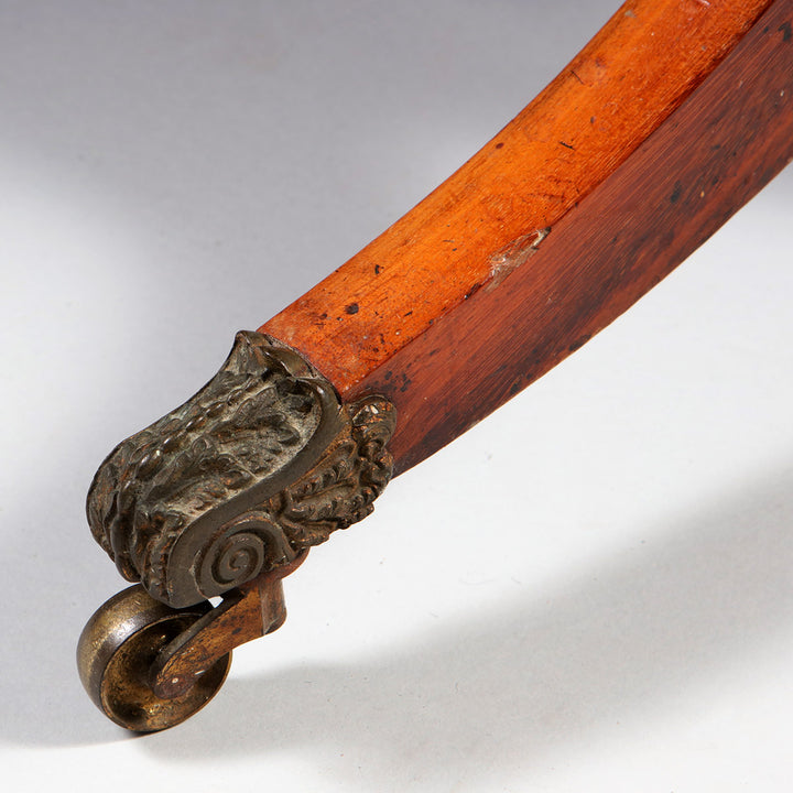 Regency Goncalo Alves Occasional Table antique wooden leg with decorative brass caster wheel detail.