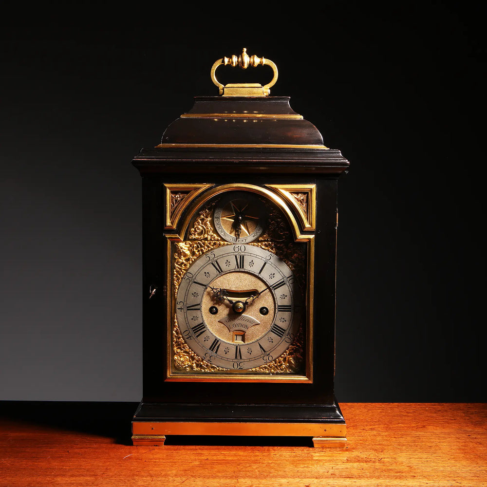 Mid 18th century ebony and gilt bronze bracket clock by John Ellicott, offered by Nicholas Wells Antiques.