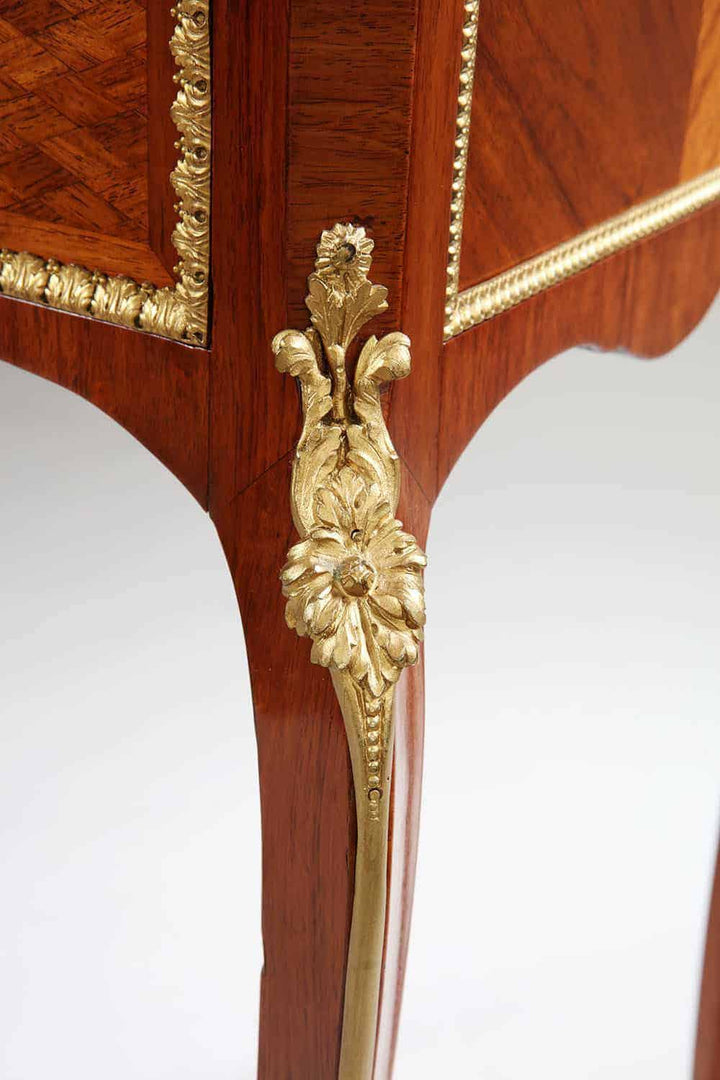 Close-up of gilt bronze floral decoration on a Napoleon III secretaire cabinet leg by Nicholas Wells Antiques