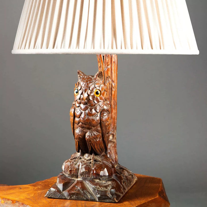 Carved Owl As A Table Lamp featuring a fine 19th century carved owl with pleated white lampshade on wooden base.
