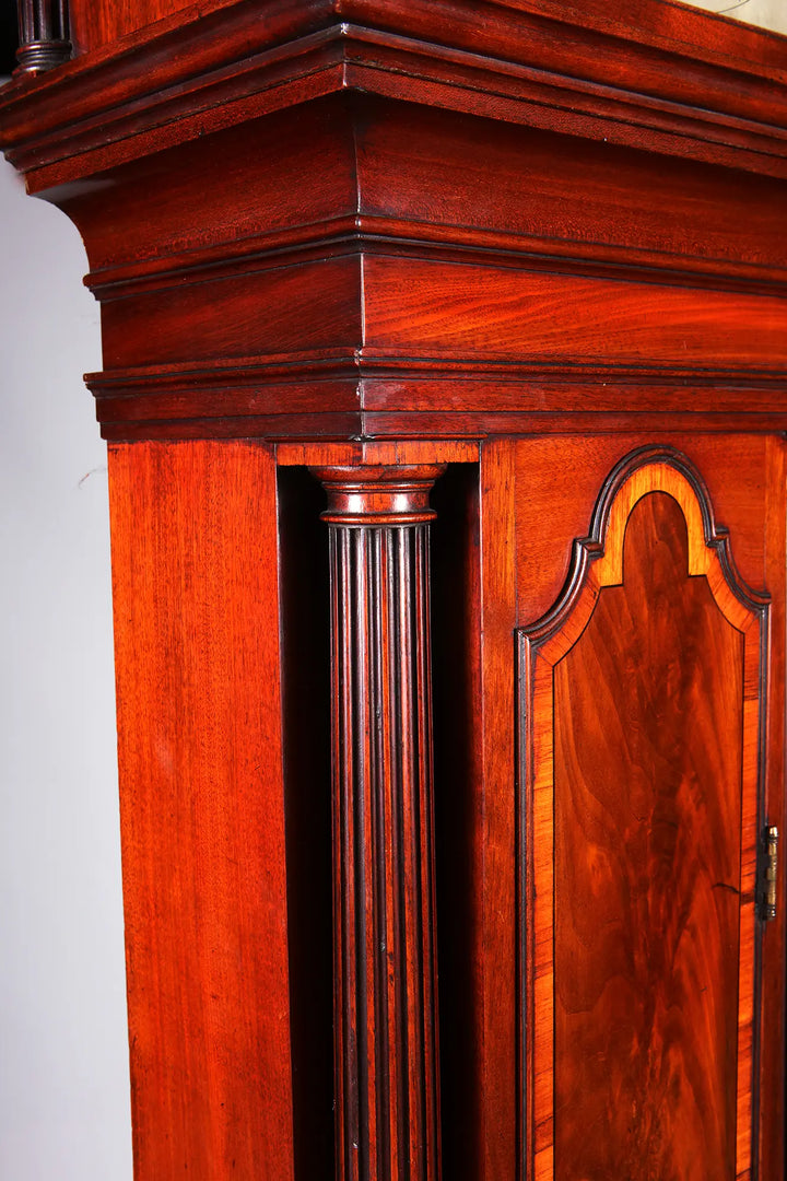 Close-up of George III mahogany longcase clock with fluted column detail by Nicholas Wells Antiques