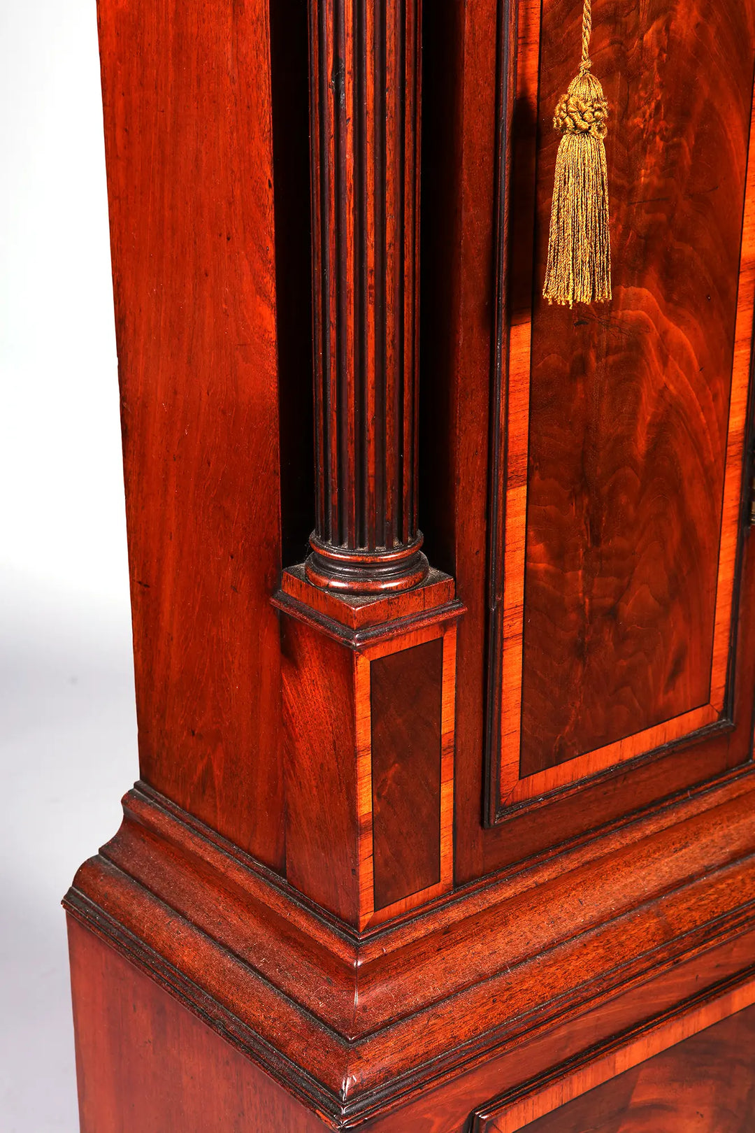 Close-up of George III mahogany longcase clock with detailed fluted column by Nicholas Wells Antiques