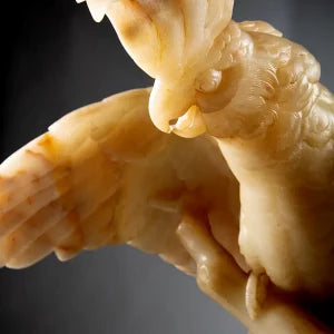 Finely Carved Alabaster Cockatoo Sculpture perched on a stylised bronze tree trunk with detailed feathers and pose.