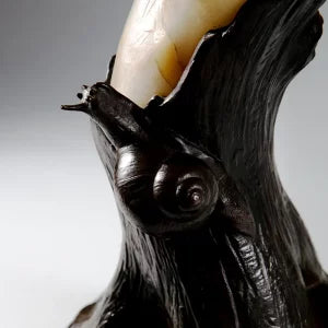 Finely Carved Alabaster Cockatoo Sculpture perched on detailed stylised bronze tree trunk stand with textured surface.