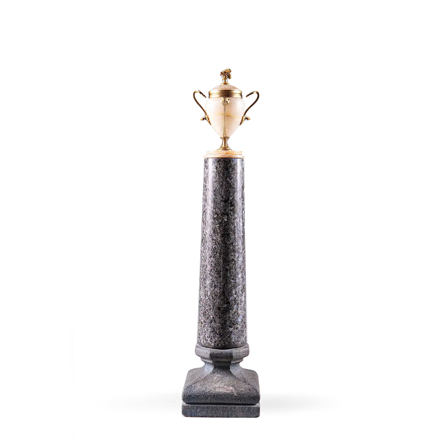 Neoclassical Urn on Granite Pedestal with alabaster body, gilded handles, bee finial, and tall dark granite base.