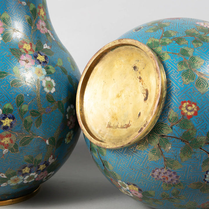 Pair of Chinese Cloisonné Enamel Vases Mounted as Lamps with turquoise floral design and gold accents circa 1880.