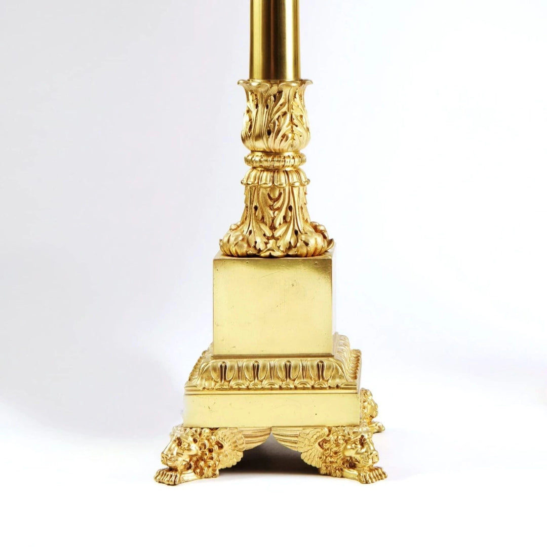 Pair of French Carcel Polished Bronze Table Lamps with lion paw feet and Corinthian fluted columns, circa 1840.