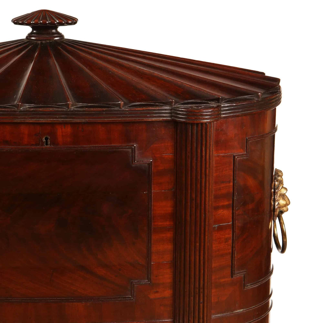 George III Cellarette Attributed To Gillows, oval mahogany cabinet with hinged lid and brass lion mask handles.