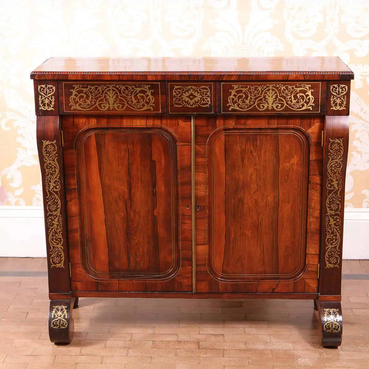 Regency rosewood side cabinet with brass inlay and scroll feet from Collection PK10 in fine antique condition