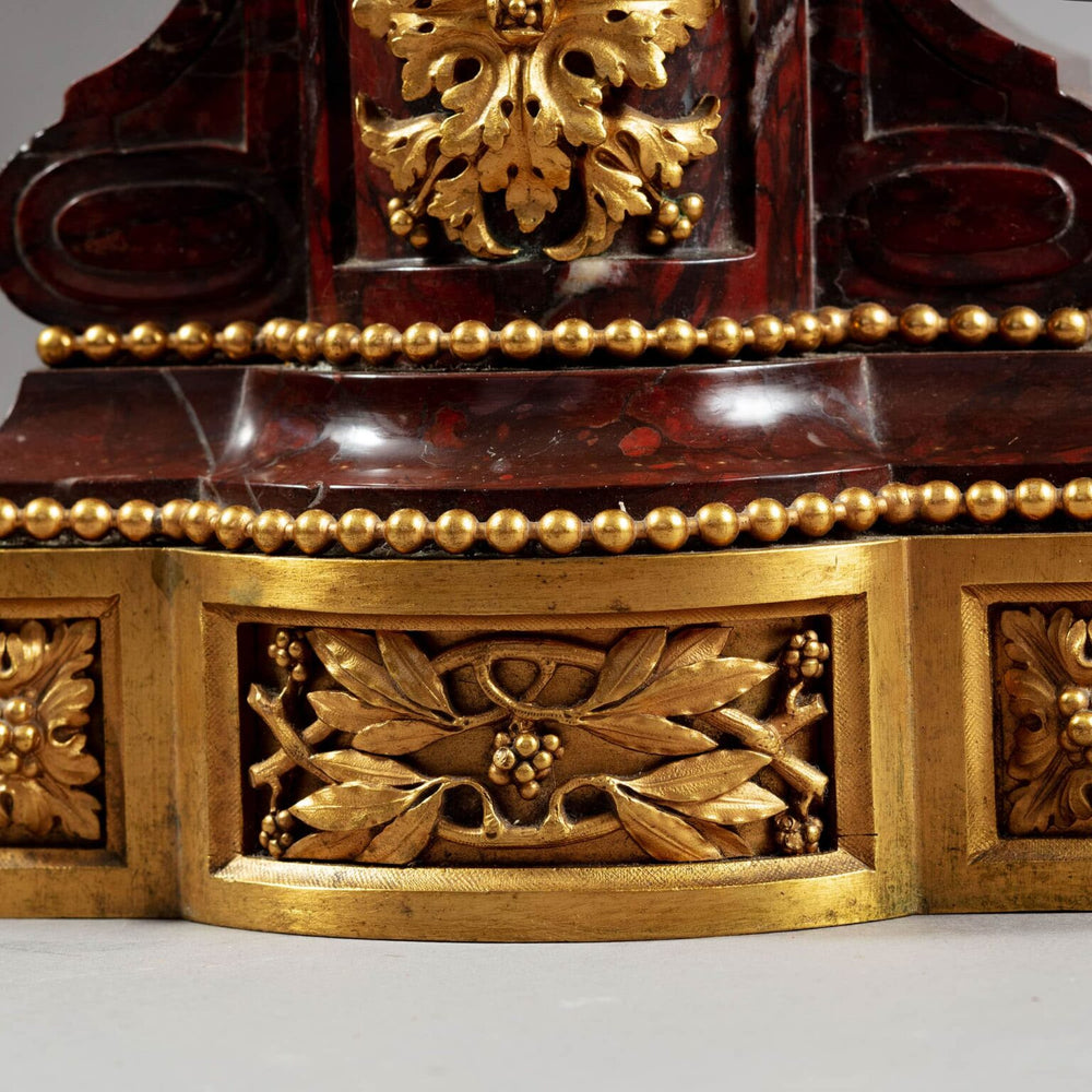 Gilt Bronze and Rosso Francia Marble Candelabra close-up showing detailed gilt bronze decorative elements.