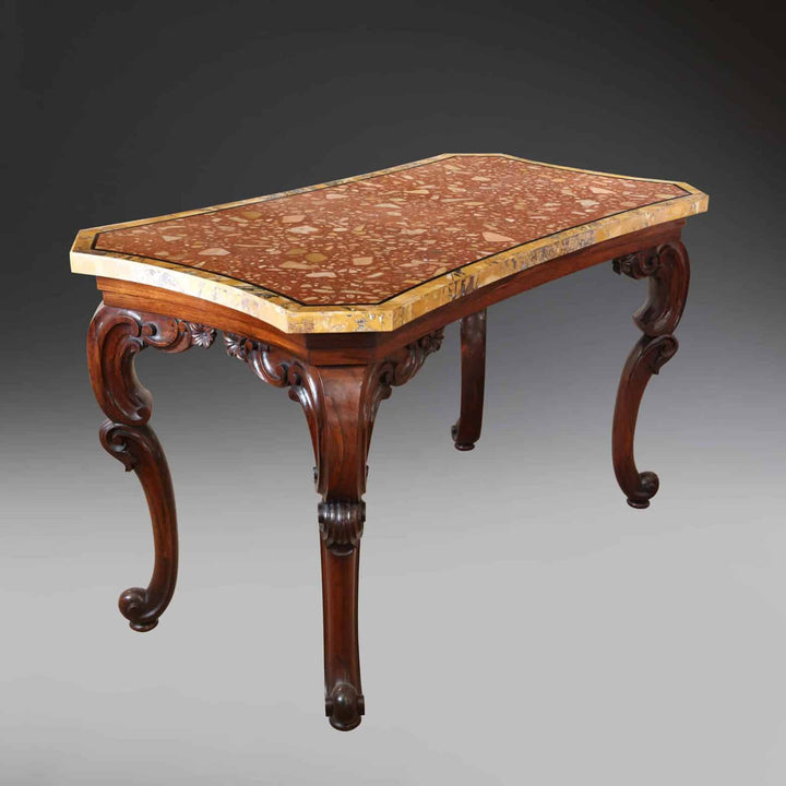 William IV Rosewood and marble centre table with Siena and brecia marble top and carved eared legs circa 1850 England