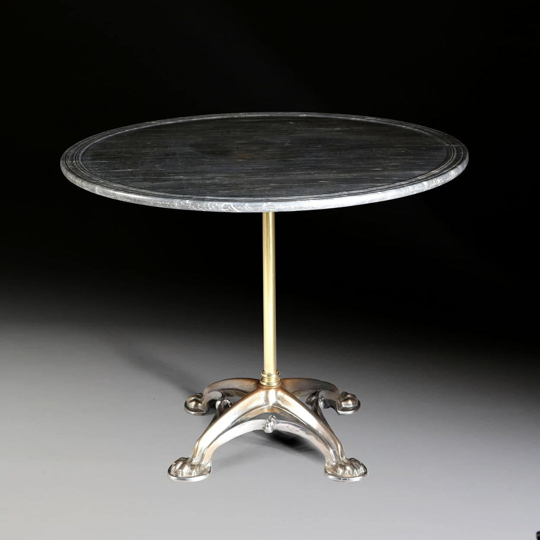 French Polished Steel & Brass Gothic Revolving Centre Table with marble top and ornate base circa 1850.