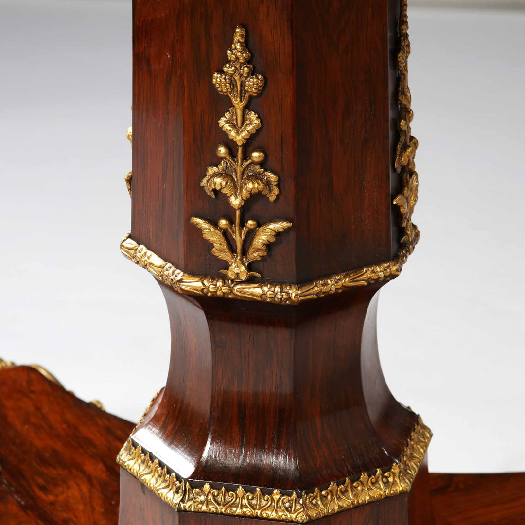 Close-up of ornate base detailing on Regency Rosewood Square Center Table with gilt metal accents and rich rosewood finish.
