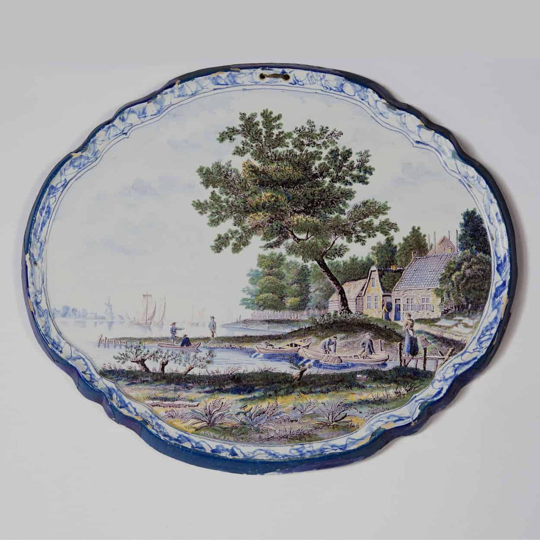 A Dutch Delft Pottery Polychrome Landscape Plaque
