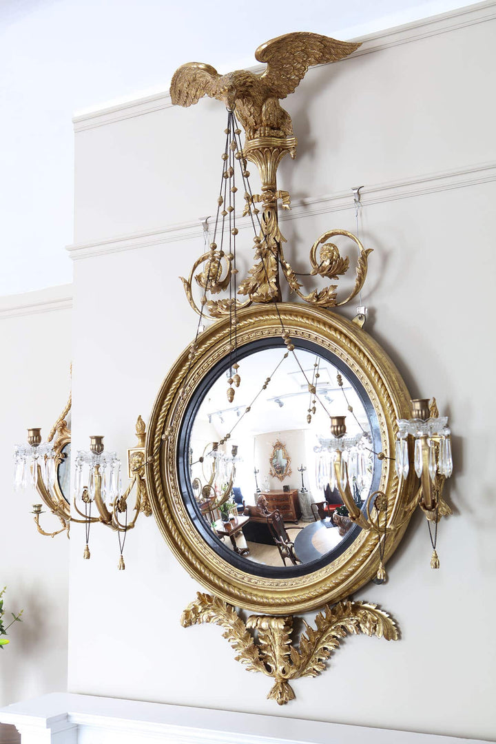 Irish Regency Convex Mirror Signed Arthur Williams, giltwood and ebonised four-light girandole with eagle crest, circa 1815.