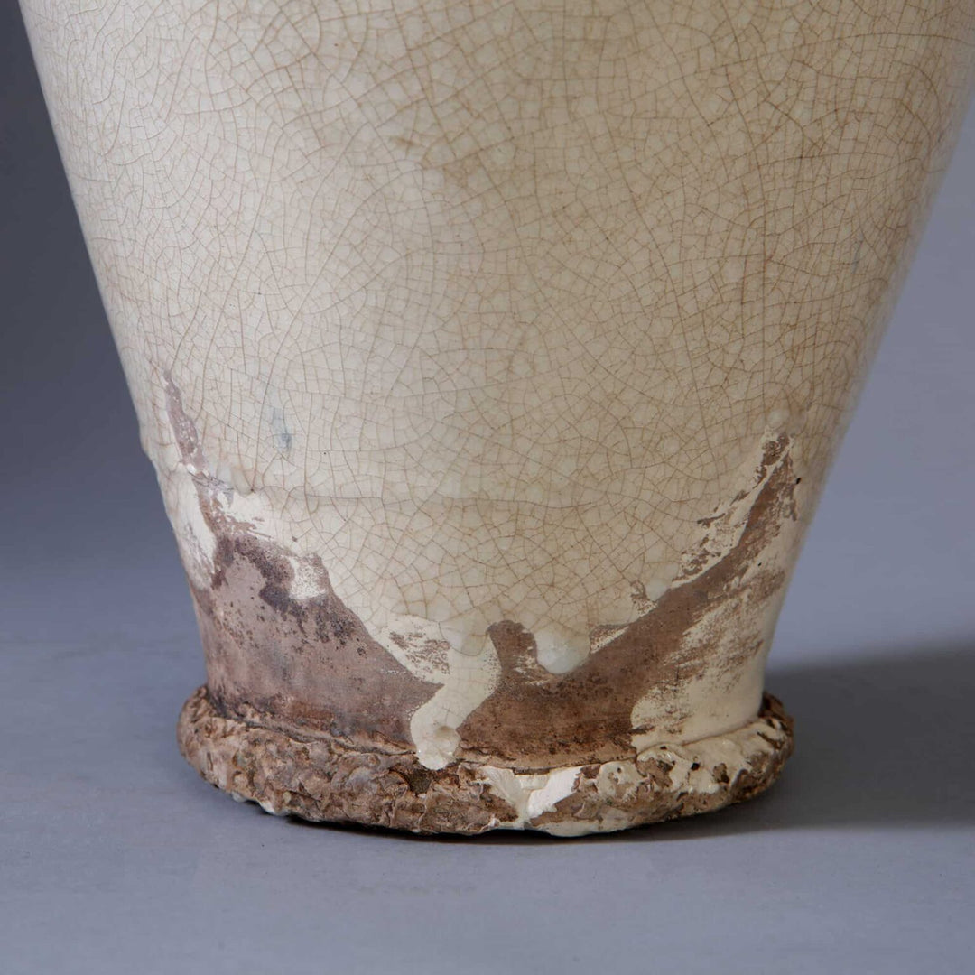 Vase attributed to Jean Besnard mounted as a table lamp with off white crackle glaze and rustic base detail.