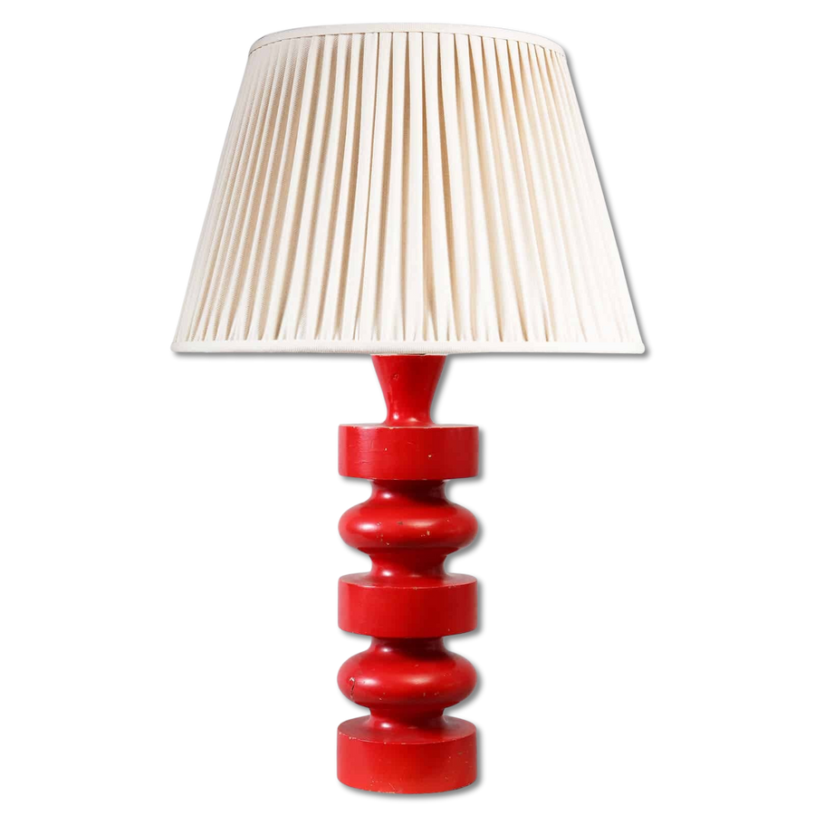 Red Lacquer Brazilian Turned Wooden Table Lamp with a glossy red turned base and a neutral fabric lampshade.