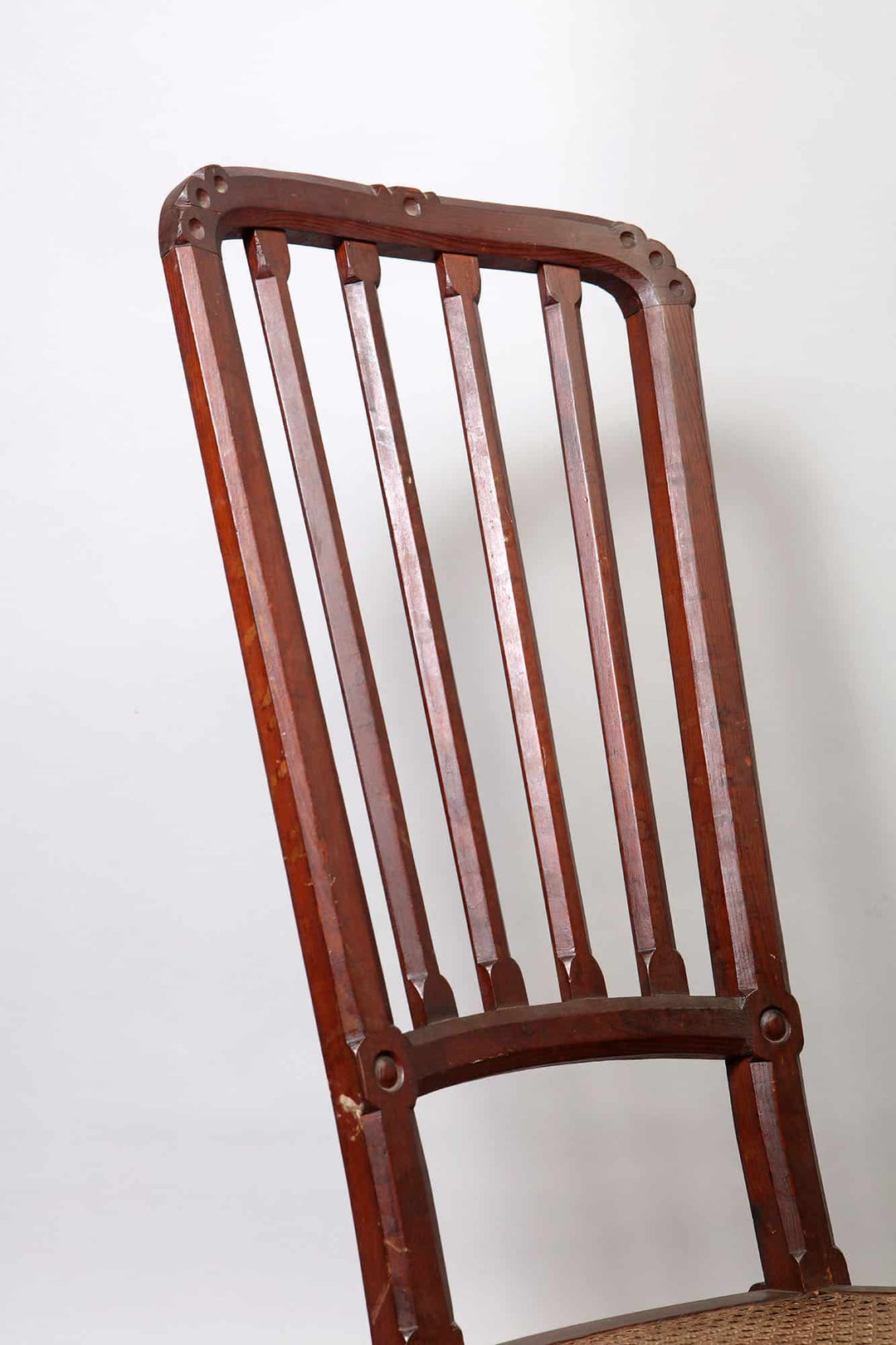 Close-up of Spanish Barcelona Chair backrest showcasing Gothic-inspired woodwork by Collection EE30