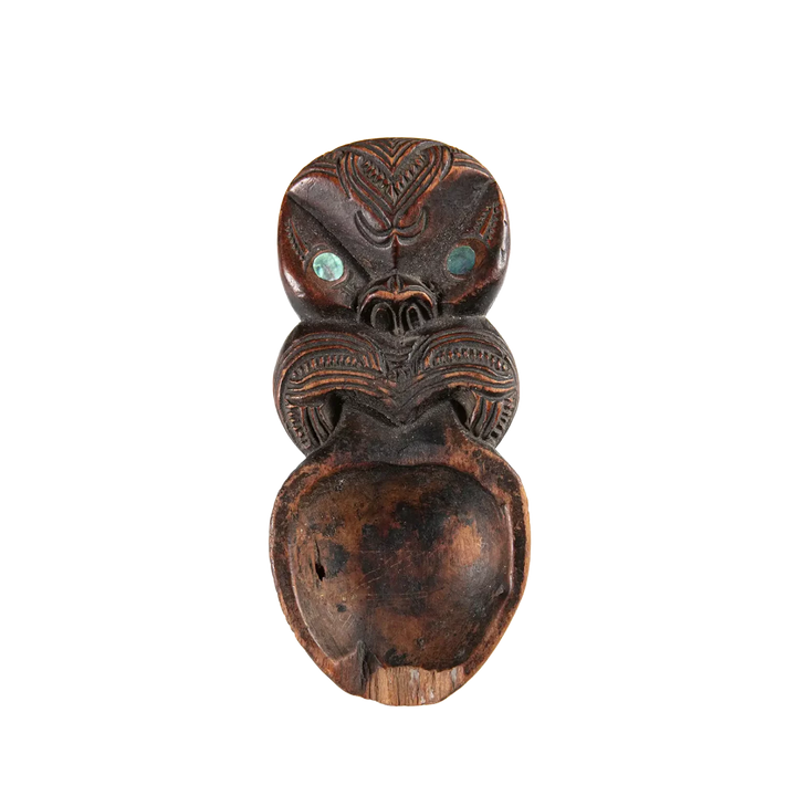 Maori Moka Tattoo Ink Holder carved wooden tray with intricate patterns and pāua shell insets from 19th century New Zealand.