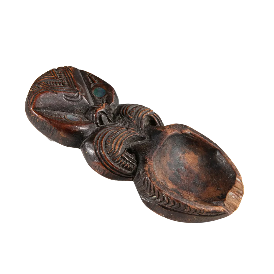 Maori Moka Tattoo Ink Holder carved with traditional patterns and pāua shell insets, vintage 19th-century ink tray.