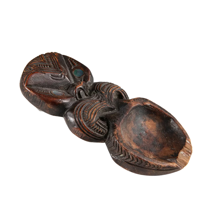 Maori Moka Tattoo Ink Holder carved with traditional patterns and pāua shell insets, vintage 19th-century ink tray.