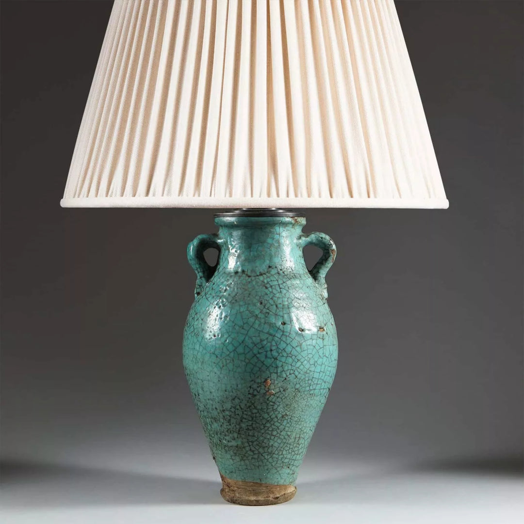 Persian Turquoise Crackle Glazed Vase Mounted as a Table Lamp with cream pleated shade and crackled turquoise base.