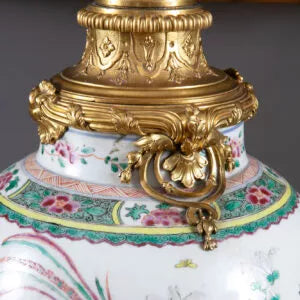 Chinese Famille Rose Mounted Vase as a Lamp with ornate gold mount and intricate floral porcelain design.