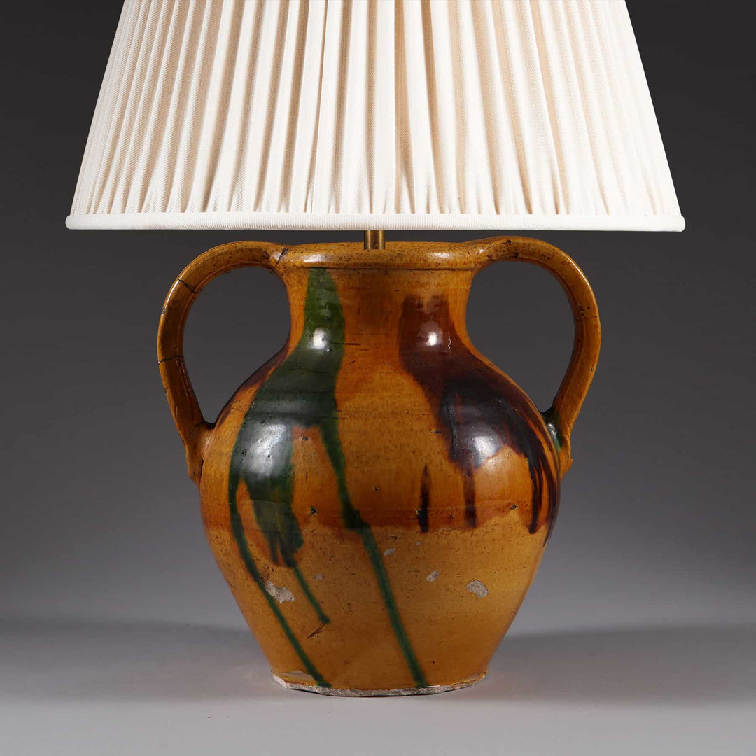 Two Handled Splash Glazed Vase Mounted as a Lamp with brown glaze and green and dark brown splash decoration.
