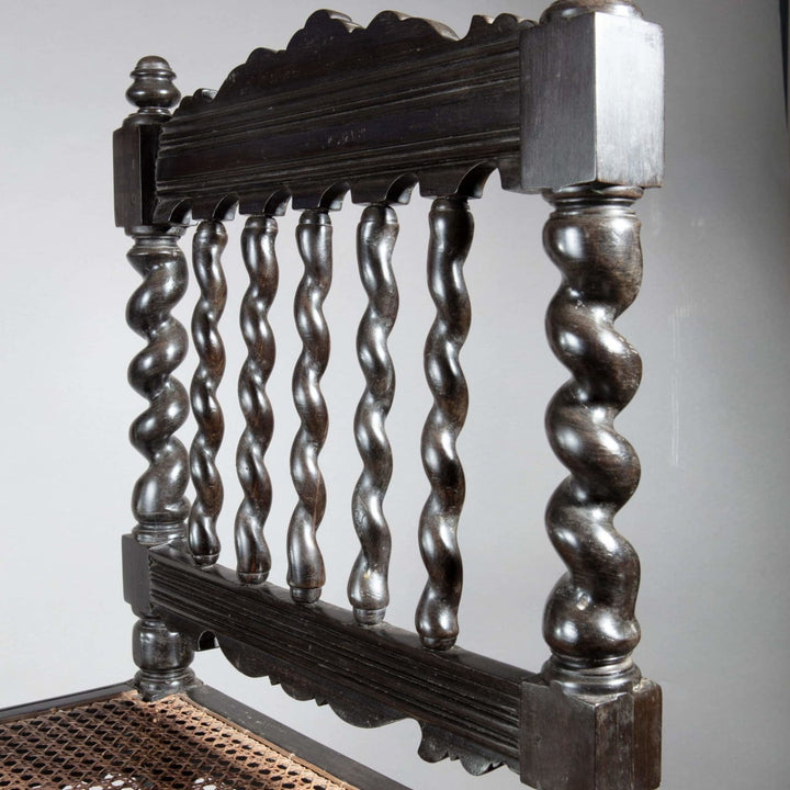 Close-up of antique solid ebony Indian hall chair back with barley twist spindles by Collection EE30