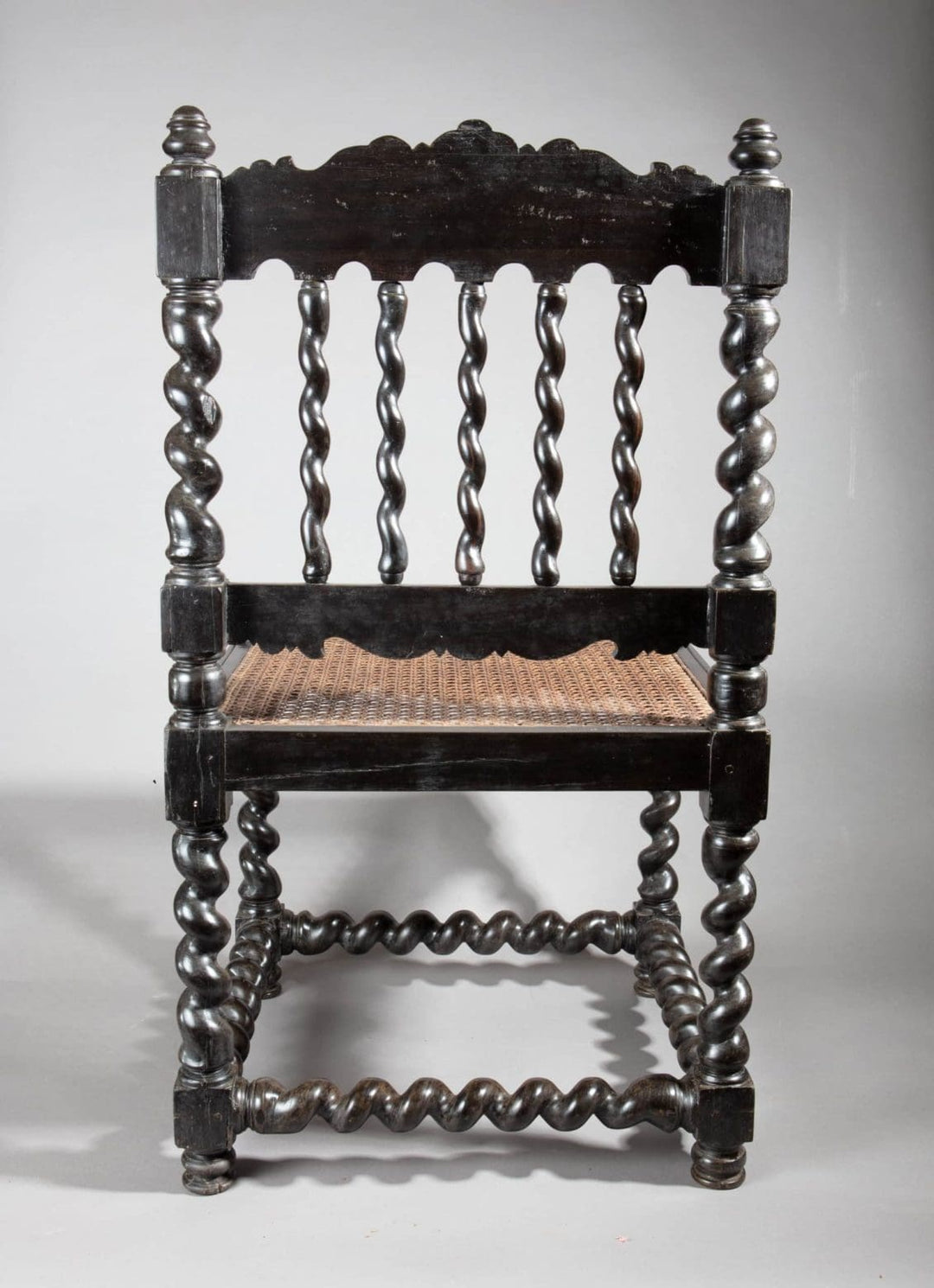 Antique solid ebony Indian hall chair with barley twist legs and caned seat from Collection EE30