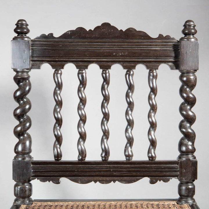 Close-up of antique solid ebony Indian hall chair back with barley twist spindles from Collection EE30