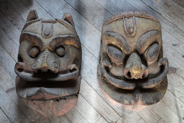 Two 19th century Ratha Yatra ceremonial wooden masks from Orissa India by Collection EE20 displayed on floor