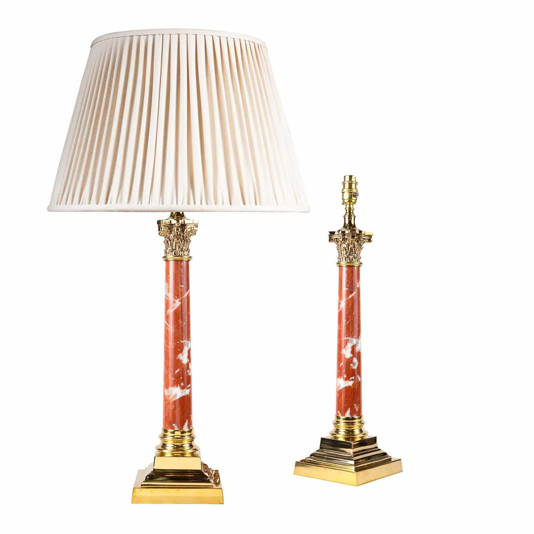 A pair of 1980s brass and Rosso Francia red marble column lamps with brass Corinthian capitals and stepped bases.