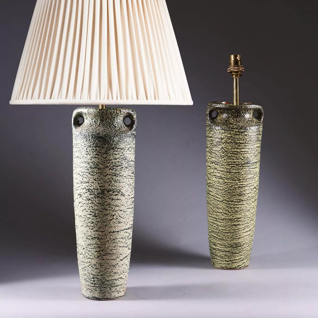 Two Volcano Vases Mounted as Table Lamps with volcanic-inspired glaze and pleated lamp shade circa 1960.