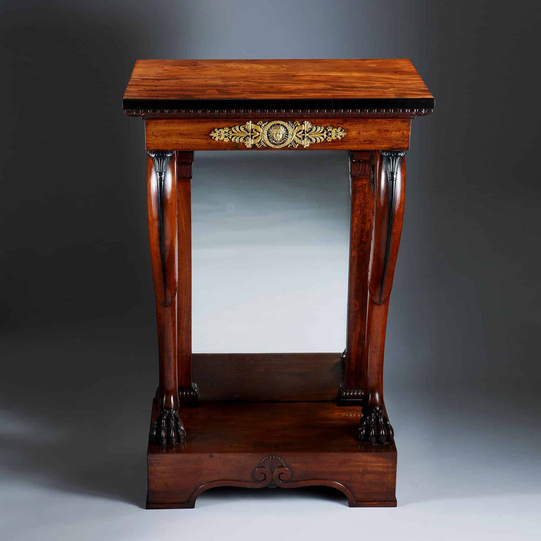 Pair of Regency Pier Console Tables in mahogany with gilt bronze mounts and mirror backs, early 19th century design.
