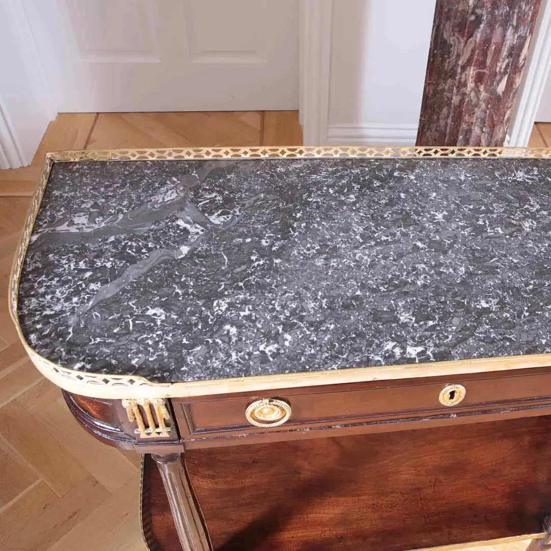 PAIR LOUIS XVI MAHOGANY CONSOLE DESSERTS with grey marble tops, brass gallery, and fluted mahogany column legs.