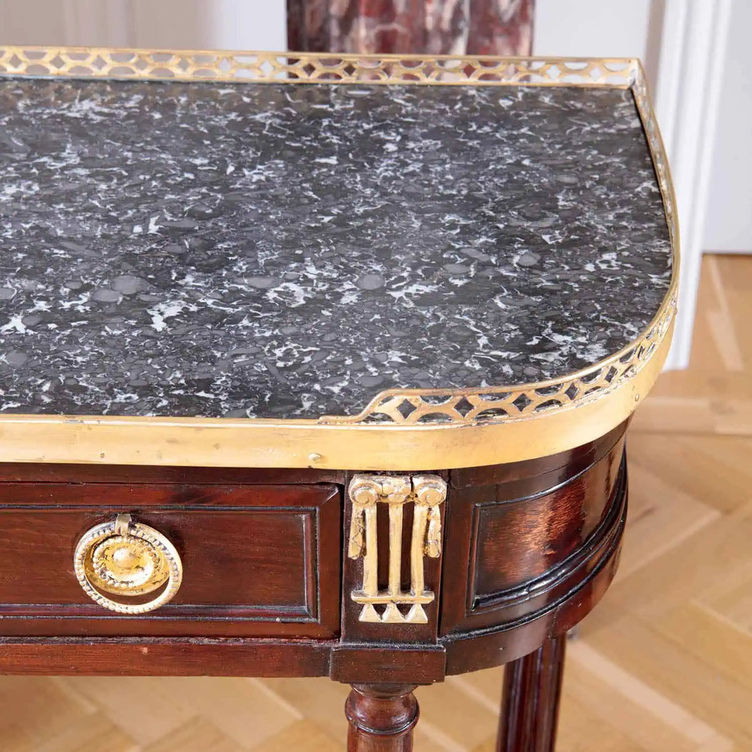 PAIR LOUIS XVI MAHOGANY CONSOLE DESSERTS with grey marble top, brass gallery, gilt ring handles, and fluted column legs.