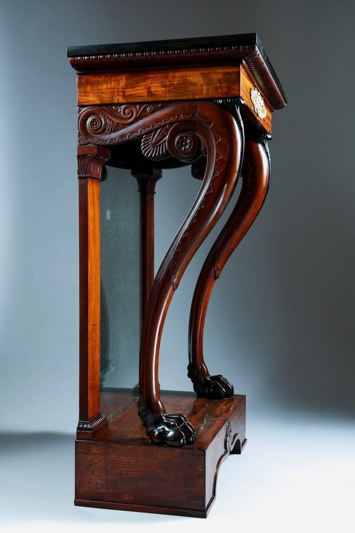 Pair of Regency Pier Console Tables with carved mahogany legs, gilt bronze mounts, and mirrored backs, circa 1810 England.