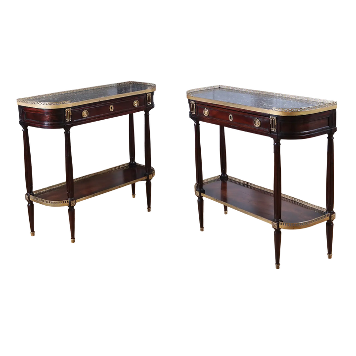 PAIR LOUIS XVI MAHOGANY CONSOLE DESSERTS with grey marble tops, brass galleries, and fluted column legs circa 1800 France.