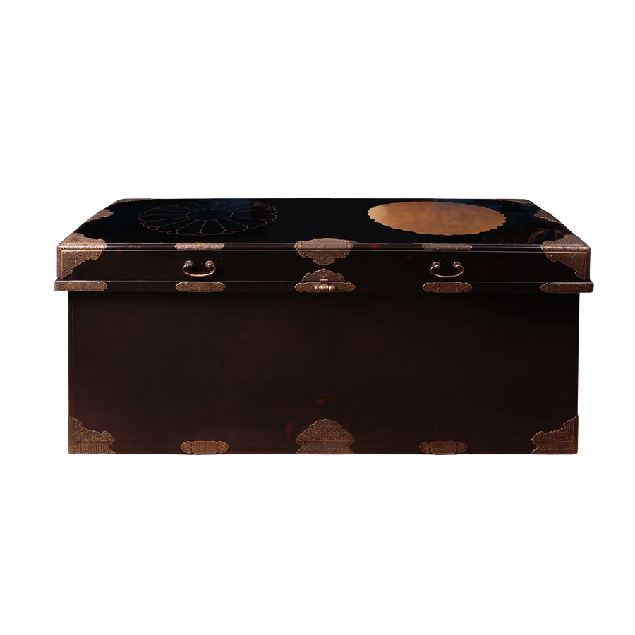 Edo Japanese Black Lacquer and Gilt Trunk with domed lid, brass mounts, drop handles, and polished black lacquer finish.