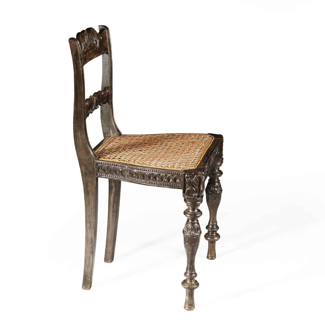 Indian Ebony Side Chair by Collection EE40 with hand-carved details and woven seat, circa 1840, elegant Anglo-Indian design.