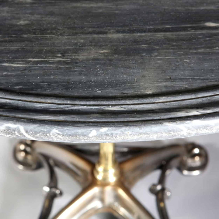 French Polished Steel & Brass Gothic Revolving Centre Table with dished marble top and brass ornate base.